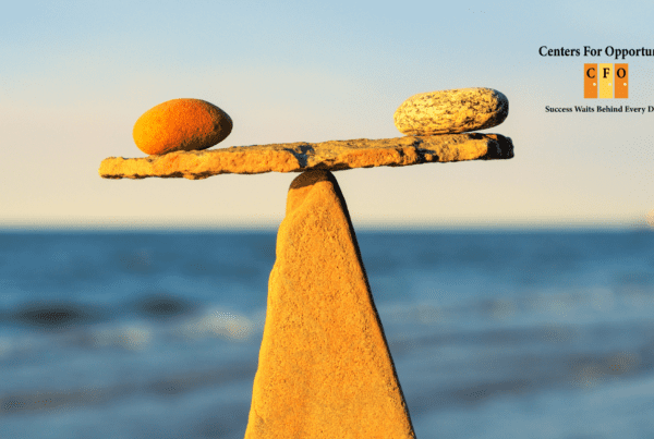 Identity - Rocks balanced with a body of water as the horizon