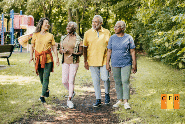 Peer facilitators building community by walking together outdoors, showing connection, empathy, and shared purpose at Centers for Opportunity.