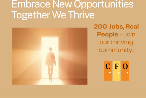 Person walking confidently through a bright doorway, representing a new employment opportunity and a step forward
