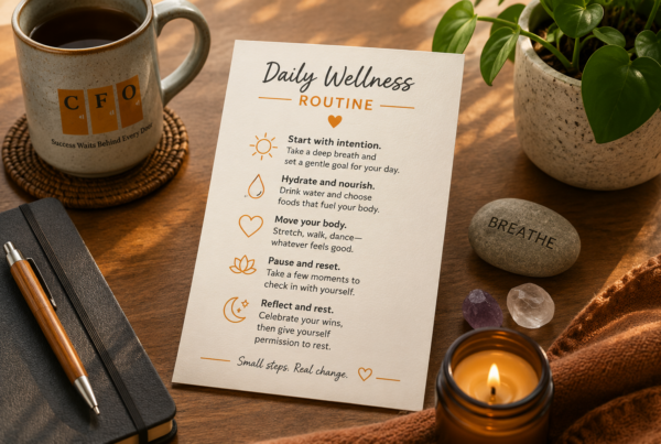A short daily wellness routine written on a card beside a few small personal objects.